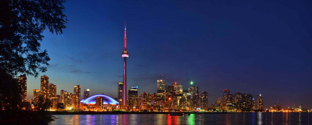 landscape photography of city town near body of water during night time, toronto